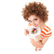 fun woman eating the cake on the white background fun woman eating the cake on the white background