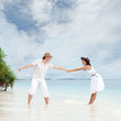 Young couple on the beach of sea