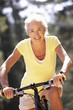 Senior woman on country bike ride