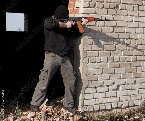 Photo: Man with gun Man with gun