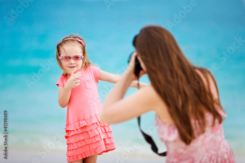 Photo: Mother photographing her daughter Mother photographing her daughter