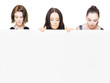 Photo: Women looking down holding a blank sign Women looking down holding a blank sign