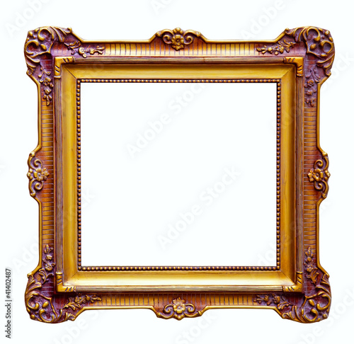 Photo: Luxury gilded frame. Isolated over white Luxury gilded frame. Isolated over white