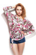 Girl posing on white wall