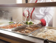 Foto: chef standing behind full lunch service station chef standing behind full lunch service station