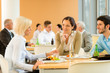 Cafeteria lunch young business people eat salad