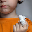 boy with a wound on his finger