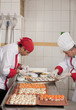 chefs garnishing canapes