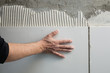 construction mason man hands on tiles work