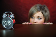 Young woman with clock.