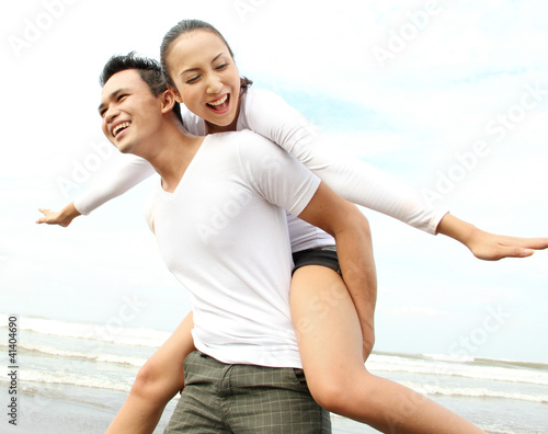 Photo: couple enjoying the beach couple enjoying the beach