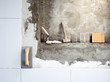 construction tools notched trowel and hammer