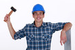 Young roofer with hammer
