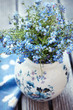 Forget-me-not flowers on a wooden table Forget-me-not flowers on a wooden table