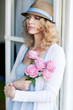 young woman in a blue dress with roses young woman in a blue dress with roses