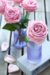 Arrangement with pink roses on a wooden background Arrangement with pink roses on a wooden background