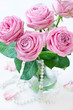 fresh pink roses on a table. fresh pink roses on a table.