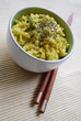 Yellow rice with saffron and zucchini in a bowl with chopsticks Yellow rice with saffron and zucchini in a bowl with chopsticks