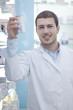 Detalii fotografie pharmacist chemist man in pharmacy drugstore