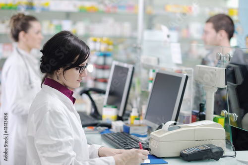 Photo: pharmacist suggesting medical drug in pharmacy drugstore pharmacist suggesting medical drug in pharmacy drugstore