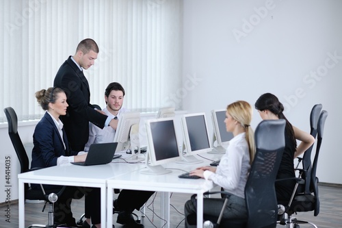 Photo: business people group working in customer and helpdesk office business people group working in customer and helpdesk office