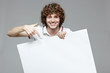 Photo: Happy handsome smiling man with banner Happy handsome smiling man with banner
