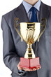 Man being awarded with golden cup