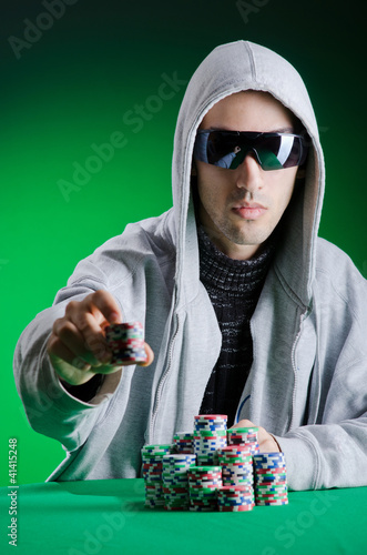 Photo: Player in casino and chips Player in casino and chips