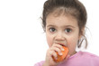 young girl eating carrot over the white background young girl eating carrot over the white background