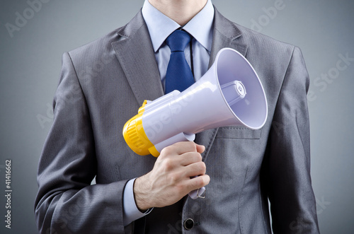 Photo: Man shouting and yelling with loudspeaker Man shouting and yelling with loudspeaker