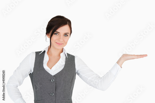 Photo: Beautiful businesswoman with her palm facing up Beautiful businesswoman with her palm facing up