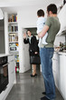 A mother leaving for work, waving goodbye to her family