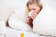 Photo: Blonde woman sneezing Blonde woman sneezing