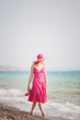 young woman on the beach in summer