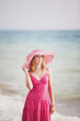 young woman on the beach in summer
