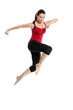 Girl in sportswear jumping jumping over white