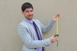 A businessman with a measuring tape