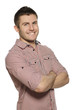 Handsome young man standing with hands folded