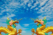 The Dragon status isolated on blue sky background