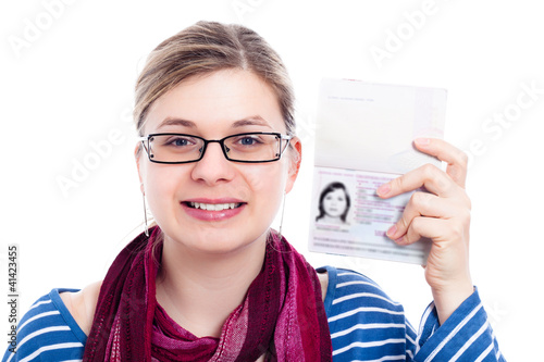 Photo: Happy tourist traveller woman with passport Happy tourist traveller woman with passport