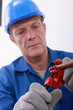 Workers holding tube