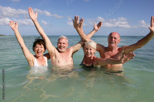 Photo: Retired people swimming in the ocean Retired people swimming in the ocean