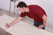 Man gluing paper