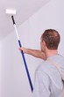 canvas print picture - Decorator painting a ceiling white