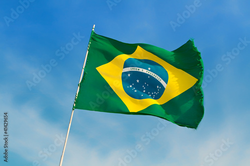 Photo: Brazil flag flutters against Brazilian blue skies Brazil flag flutters against Brazilian blue skies