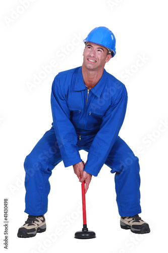 Photo: Plumber with plunger Plumber with plunger