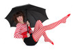 Woman with funky tights under an umbrella