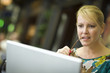 Beautiful Blonde Woman On Her Cell Phone and Laptop Computer in Beautiful Blonde Woman On Her Cell Phone and Laptop Computer in