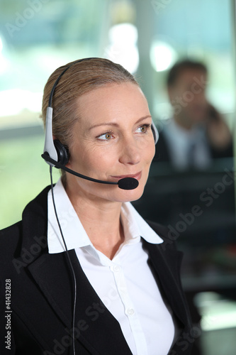 Photo: Woman with headset Woman with headset