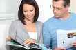 couple reading magazines